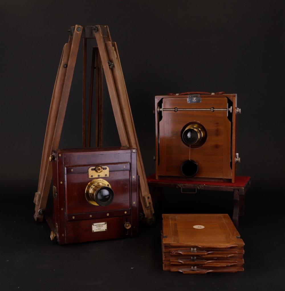 Auction comp thumbnail for Two antique cameras with tripods, one marked A. W. Watson & Son. Includes a matching wooden tripod. (Medusa Auctioneers, Lot 123)