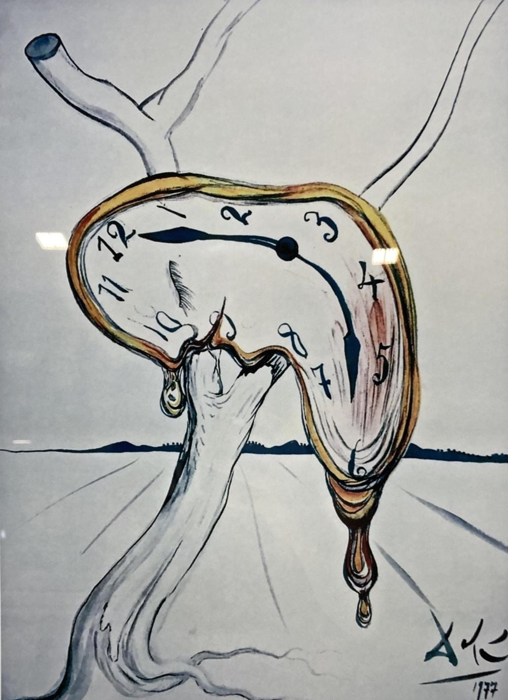 Surreal printed image showing a distorted hanging clock.