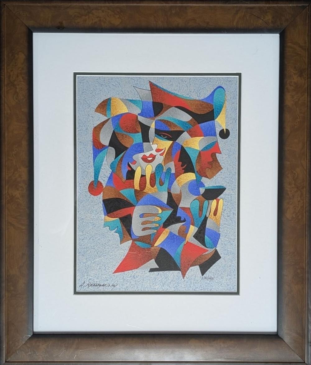 Colorful abstract portrait print with overlapping faces and patterned shapes in red, blue, yellow, and black, framed in brown wood.