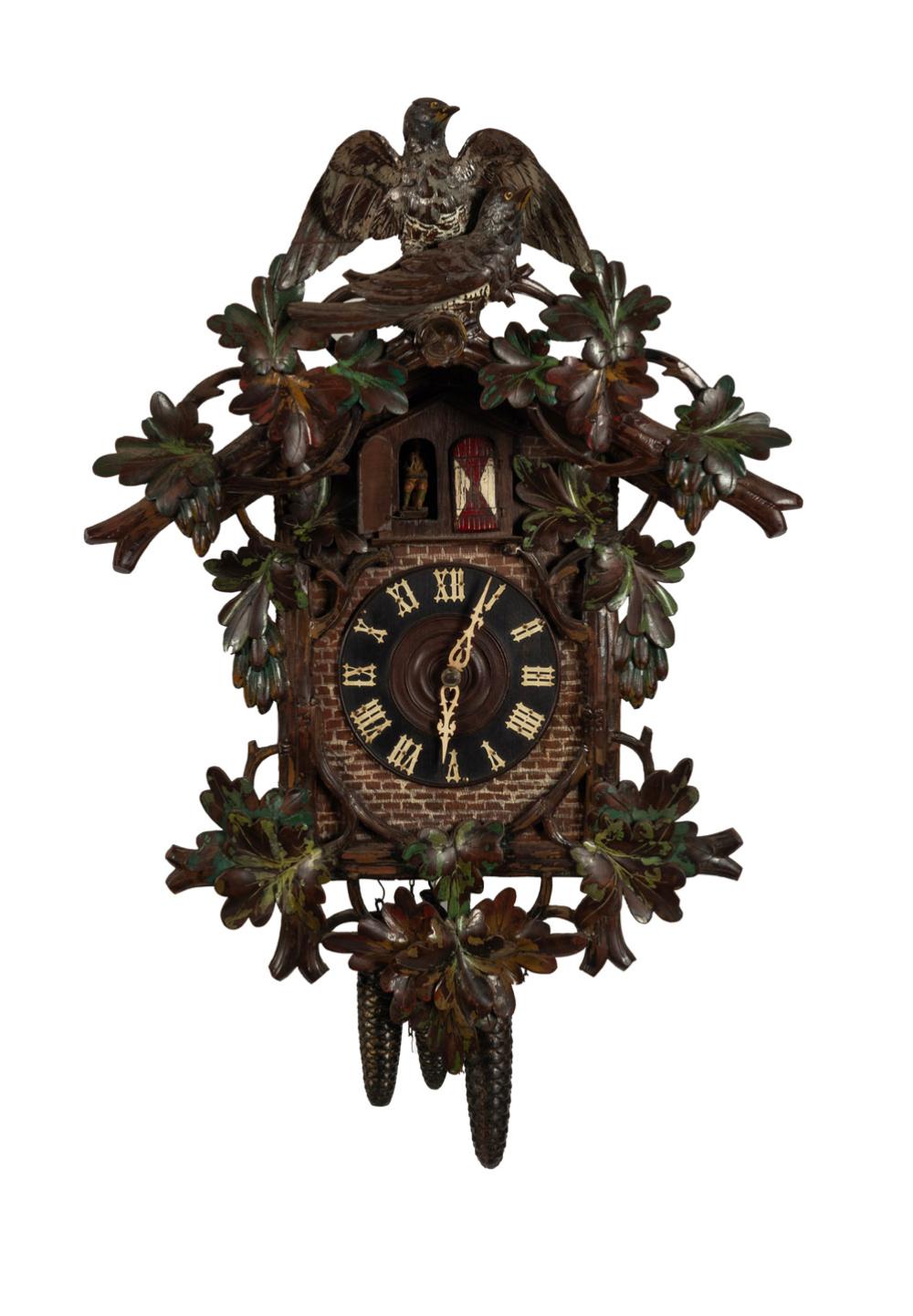 BLACK FOREST antique German cuckoo wall clock with three train weight driven movement playing a Swiss music box cylinder movement on the hour, with remnants of polychrome finish, 19th century. Note: Mismatched pendulum but weights present. 84cm high sold by Leski Auctions Pty Ltd, lot 278 — auction record photograph