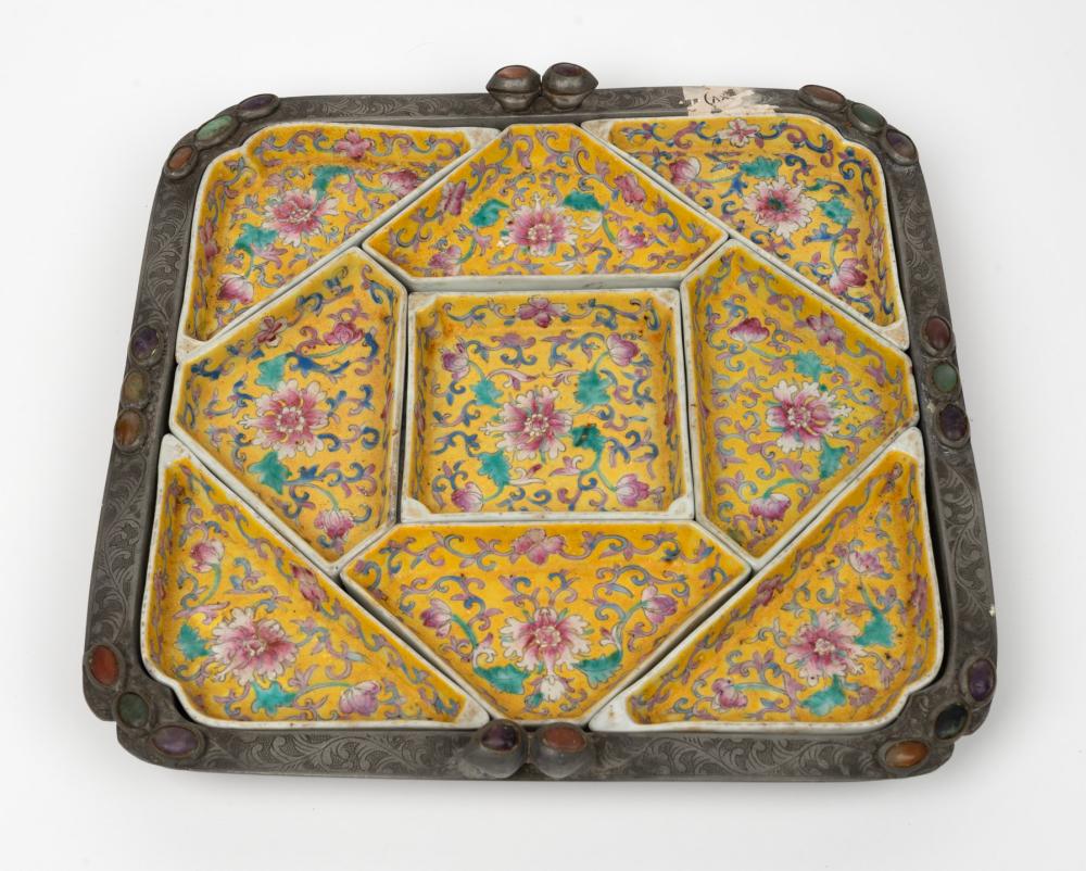 An antique Chinese porcelain savoury dish set with yellow ground in original pewter and polished stones surround, Qing Dynasty, 19th/20th century, 29cm wide. sold by Leski Auctions Pty Ltd, lot 301 — auction record photograph