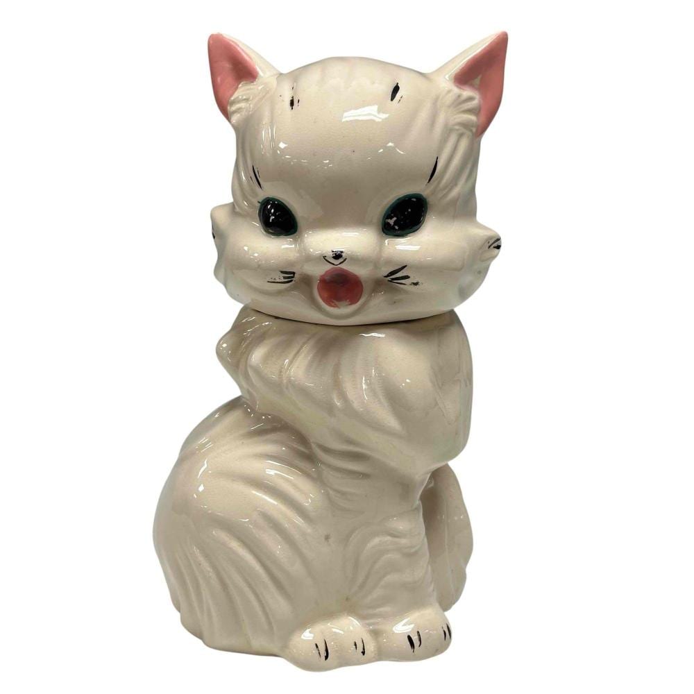 White cat-shaped cookie jar with pink nose and ears, glossy glaze, and closed mouth detail.