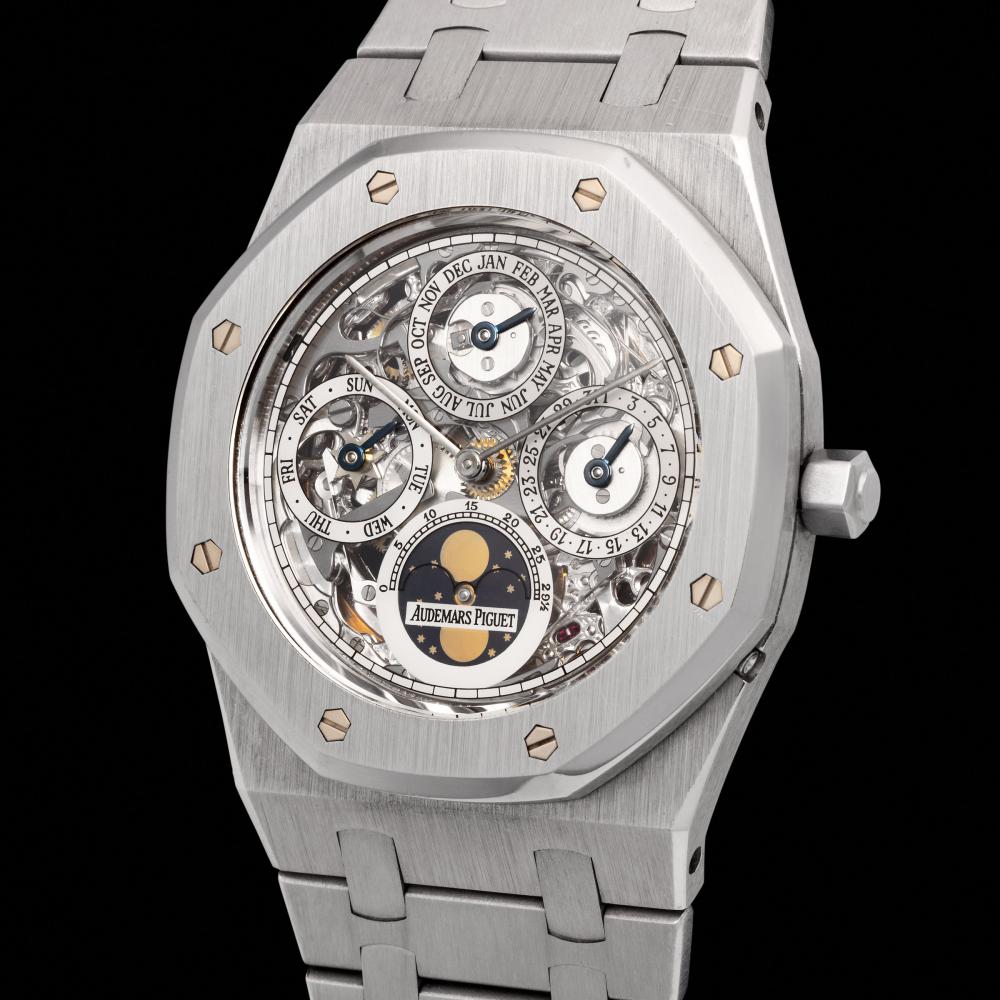 Audemars Piguet. A very rare and incredibly attractive, Perpetual Calendar, moonphases wristwatch in platinum, with openworked dial, certificate of origin, VHS instruction manual, winding presentation box, reference 25636PT. sold by Monaco Legend Group, lot 131 — auction record photograph
