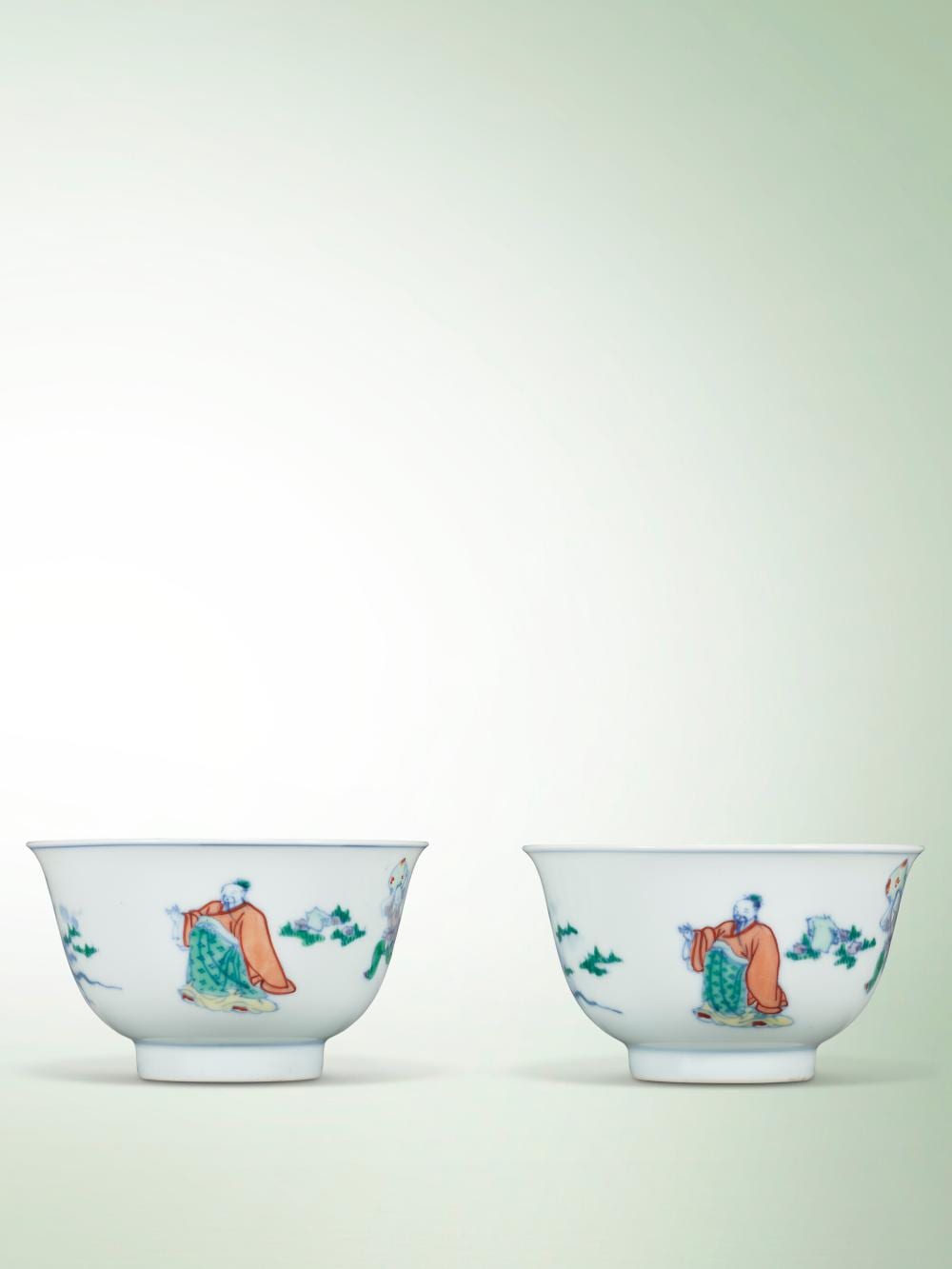 A Fine Pair Of Doucai ‘FIGURAL’ TEA BOWLS. KANGXI SIX-CHARACTER MARKS IN UN comparable sale