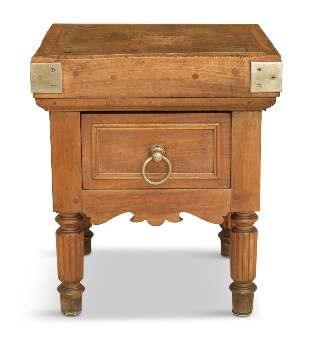 Wooden butcher block with a rectangular drawer and brass ring pull on the front, shown front view.