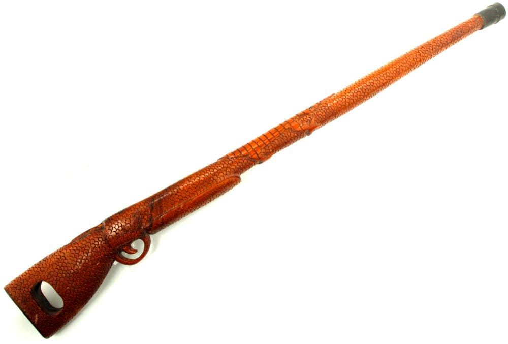 Interesting IDENTIFIED Antique Carved Wood Walking Cane in Form of a Rifle. sold by Sofe Design Auctions, lot 8691 — auction record photograph