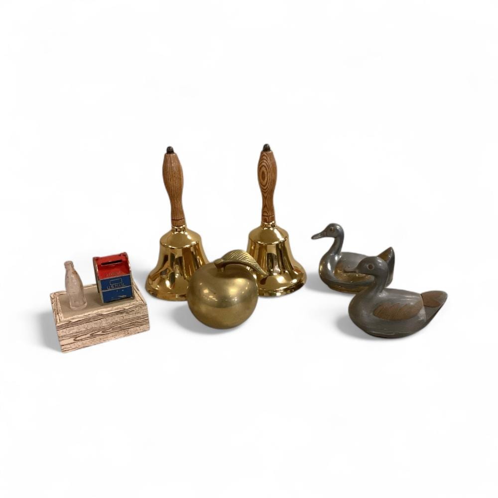Brass Apple, Pair of Vintage Pewter and Brass Duck-Shaped Trinket Boxes, Pair of Brass Hand Bells with Wooden Handles, Miniature Mail Box, and Coke Bottle sold by Apple Tree Auction Center, lot 559B — auction record photograph