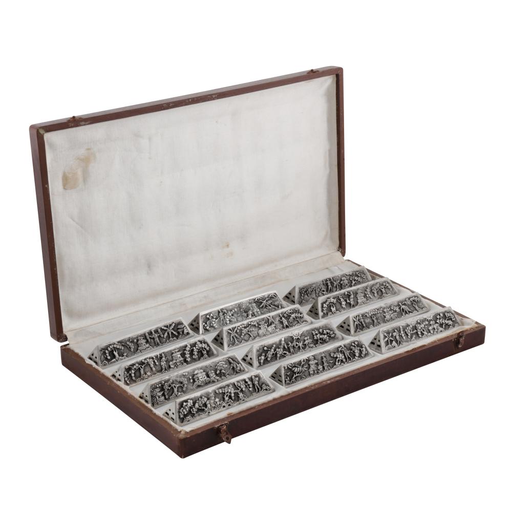 Hanoi circa 1960 A cased set of mid-20th century Vietnamese unmarked silver knife rests sold by Chiswick Auctions, lot 161 — auction record photograph