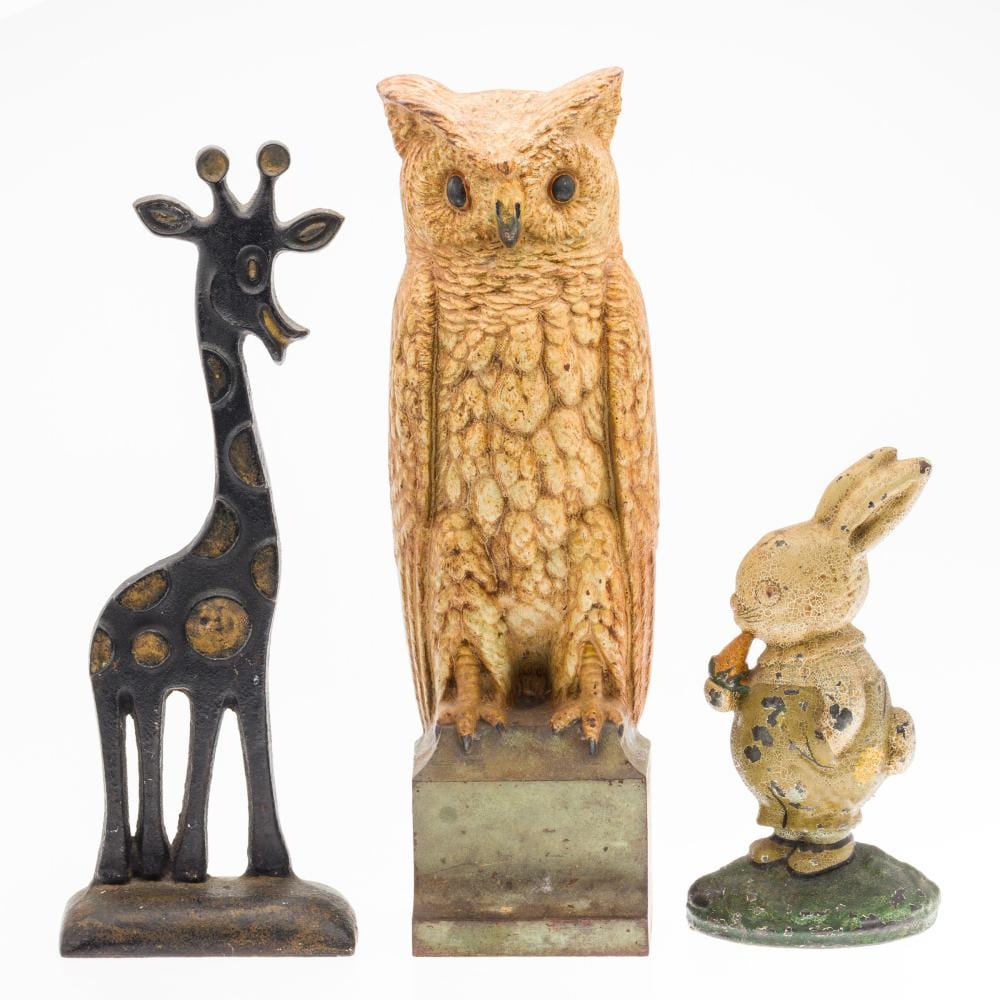 3 Cast Iron Door Stops, Incl. Bradley & Hubbard sold by Everard Auctions and Appraisals, lot 205 — auction record photograph