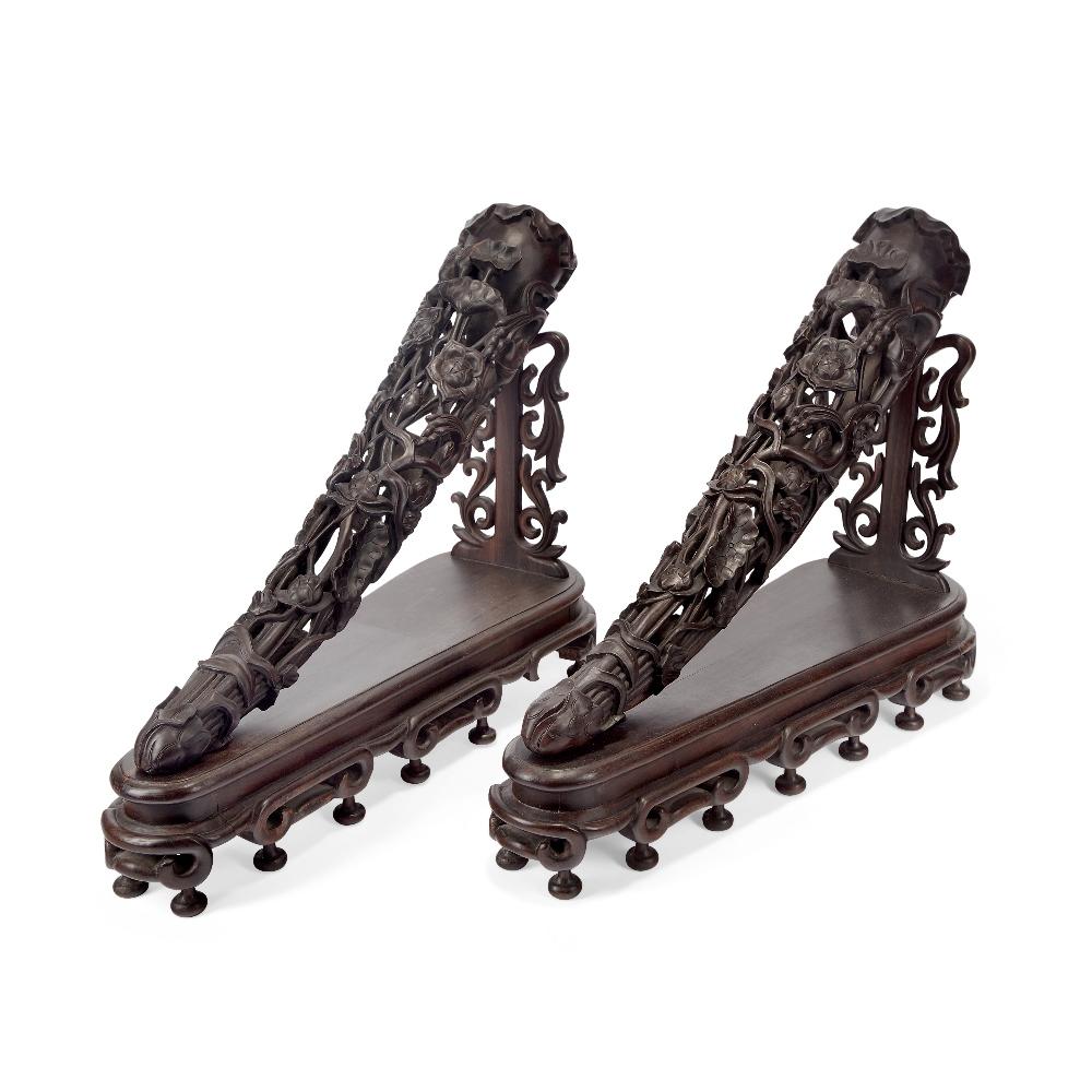 A pair of Chinese zitan faux rhinoceros horn tips sold by Roseberys, lot 385 — auction record photograph