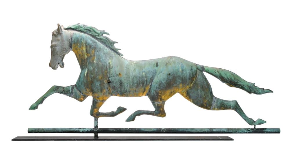 Patinated metal horse weathervane shown in side profile, with tail extended and mounted on a base.