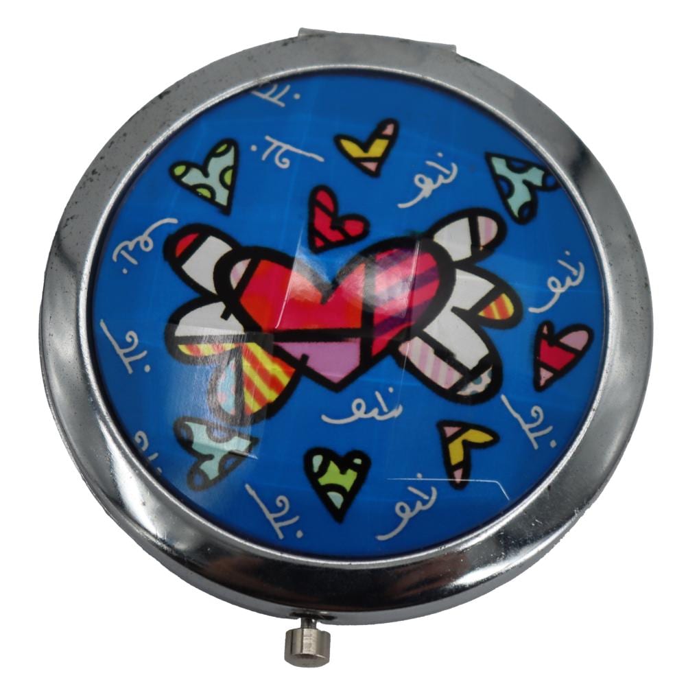 Romero Britto (Born 1963) Brazilian/American, Compact Mirror in Original Box sold by Sarasota Estate Auction, lot 760 — auction record photograph