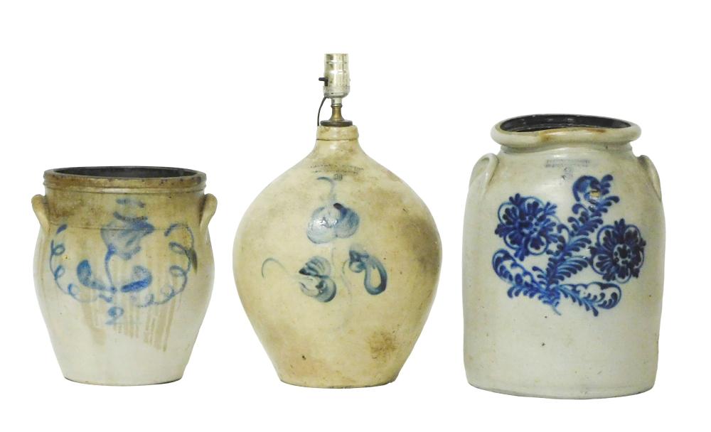 Three American salt-glazed stoneware vessels, two crocks and one jug mounted as table lamp, details include: two gallon ovoid jug table lamp, cobalt flower decoration, stamped "Norton & Fenton, Bennington V." and "2",... sold by Winter Associates, Inc., lot 47 — auction record photograph