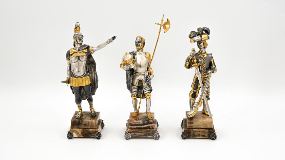 Giuseppe Vasari comparable auction result: a lot of three 20th century bi color patinated bronze figures of warriors by giuseppe vasari