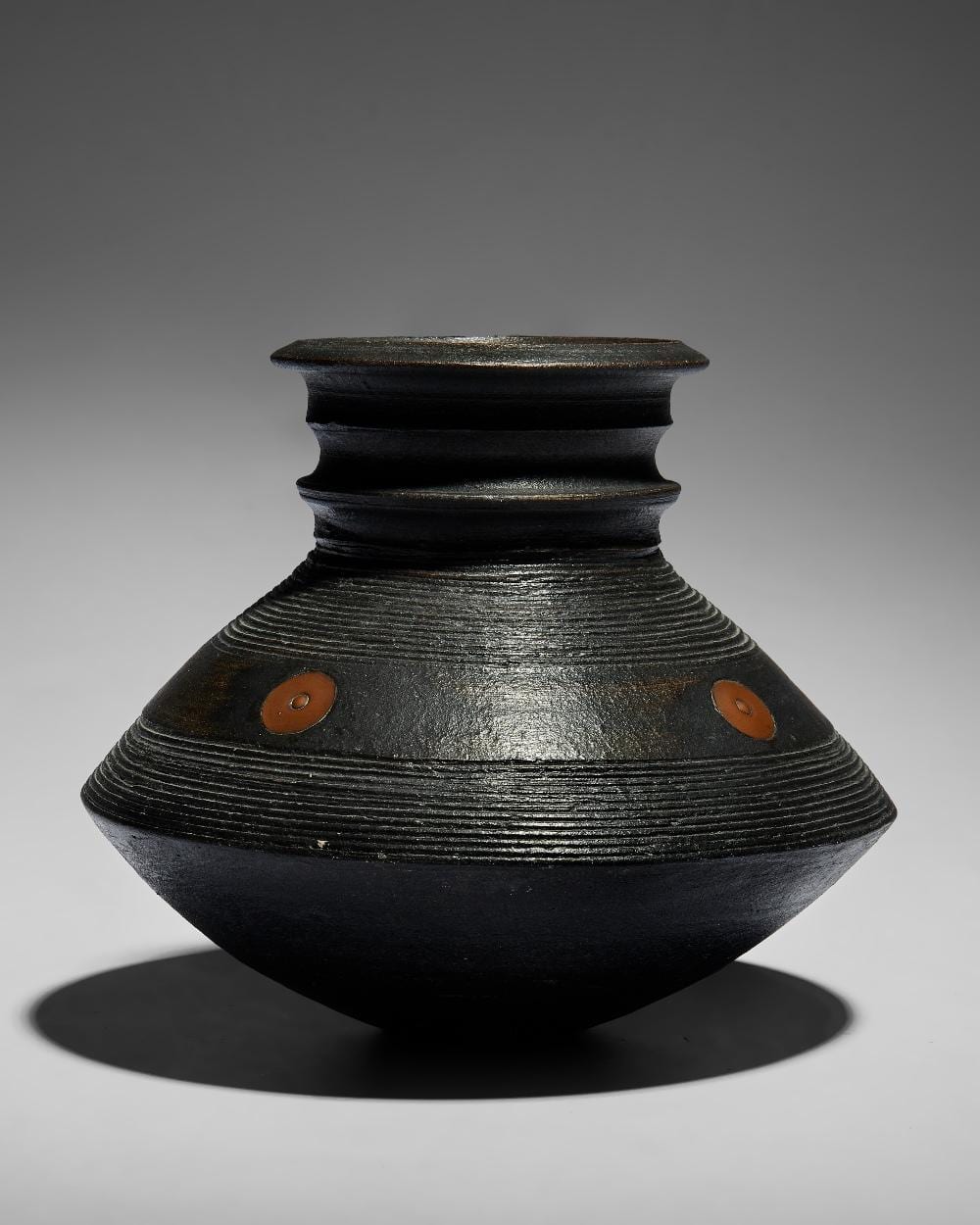 jason wason b 1946 vase with two combed bands and copper medallions circa 1997 · Roseberys · 2025-11-18 Jason Wason comparable auction result: jason wason b 1946 vase with two combed bands and copper medallions circa 1997