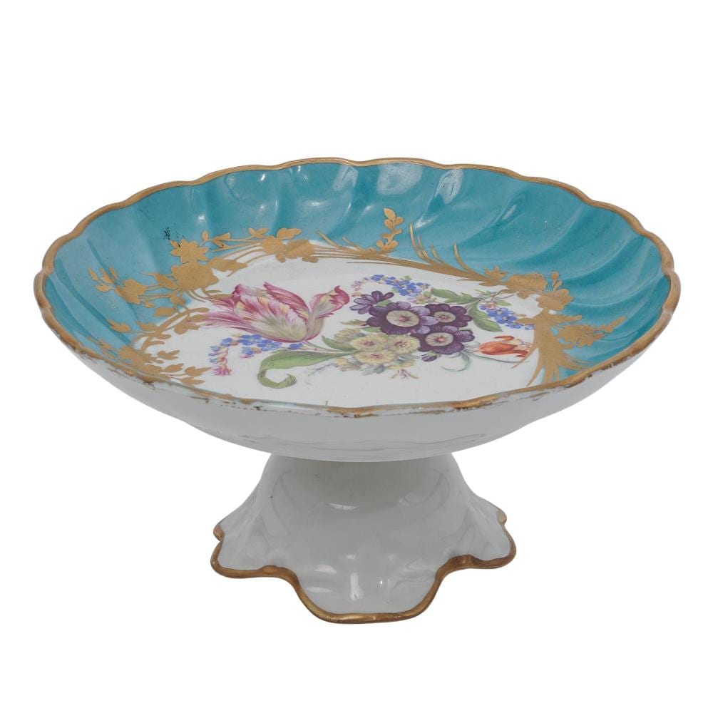 Blue and floral footed porcelain candy dish with scalloped rim and a pedestal base.