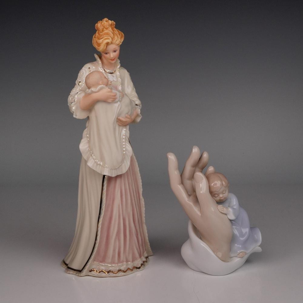 Sandra Kuck comparable auction result: a pair of porcelain figurines including lenox god s gift by sandra kuck