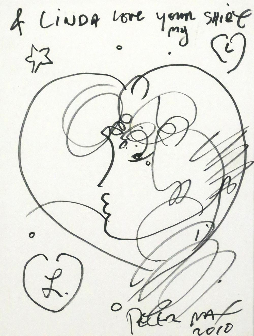 Marker drawing of a face within a heart, with handwritten dedication and signature.