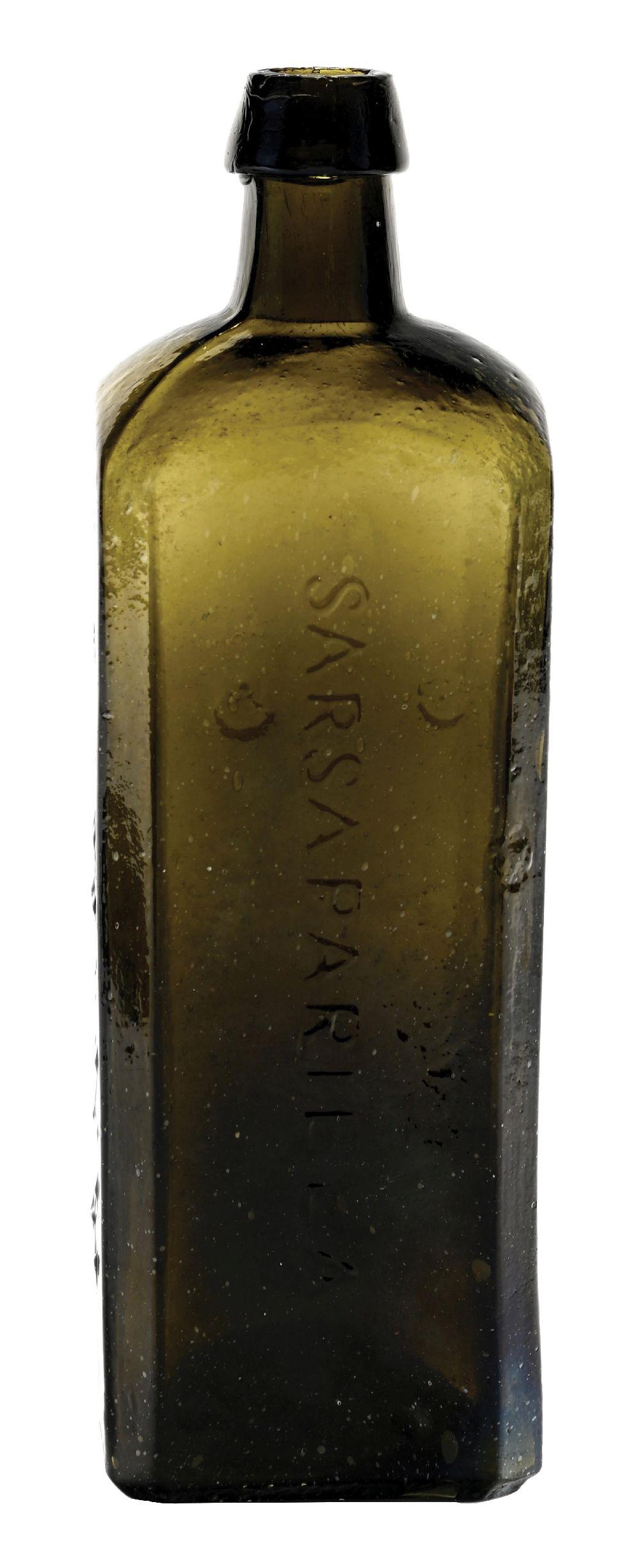 Close-up of a green glass bottle with a dark metal-like cap and embossed vertical markings on the front.