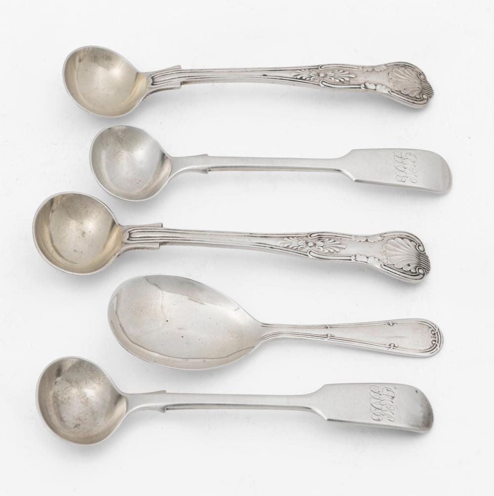 Five metal spoons with oval bowls and decorative handles, shown side by side on a white background.