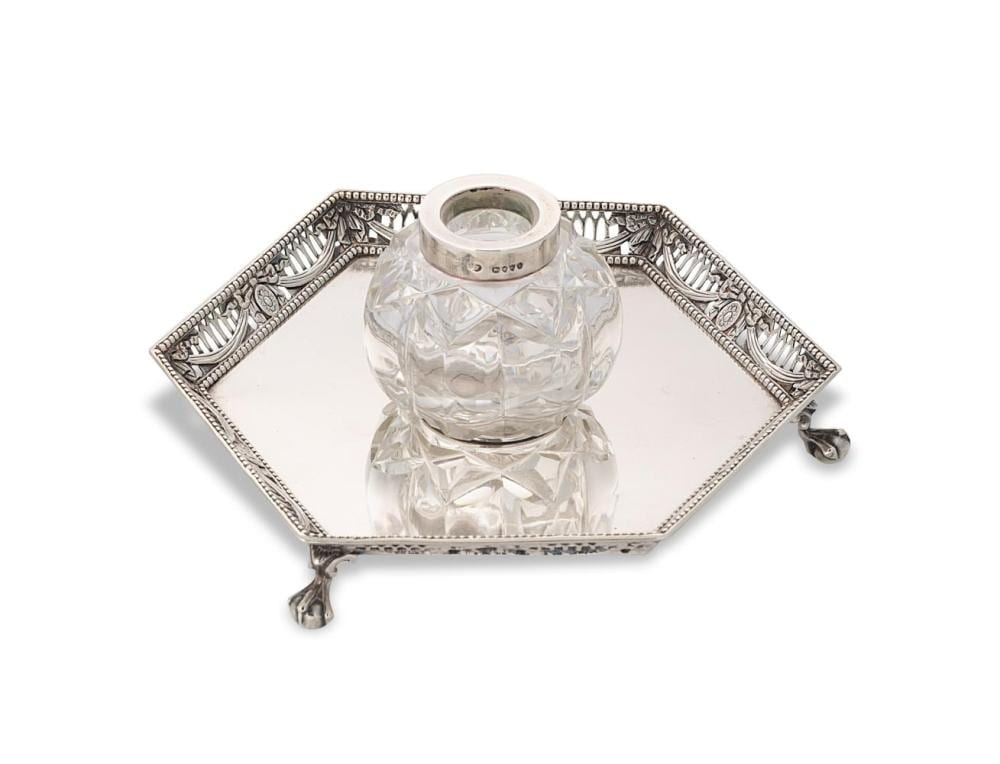 Victorian-style silver and cut-glass inkwell with octagonal base and hinged handle, clear glass bottle fitted with a metal collar
