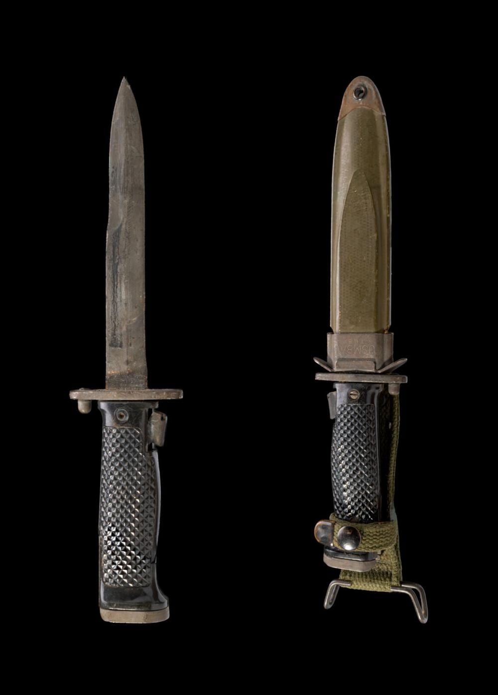 Two military knives displayed side by side: one with a pointed blade and textured handle, and one with a matching scabbard.