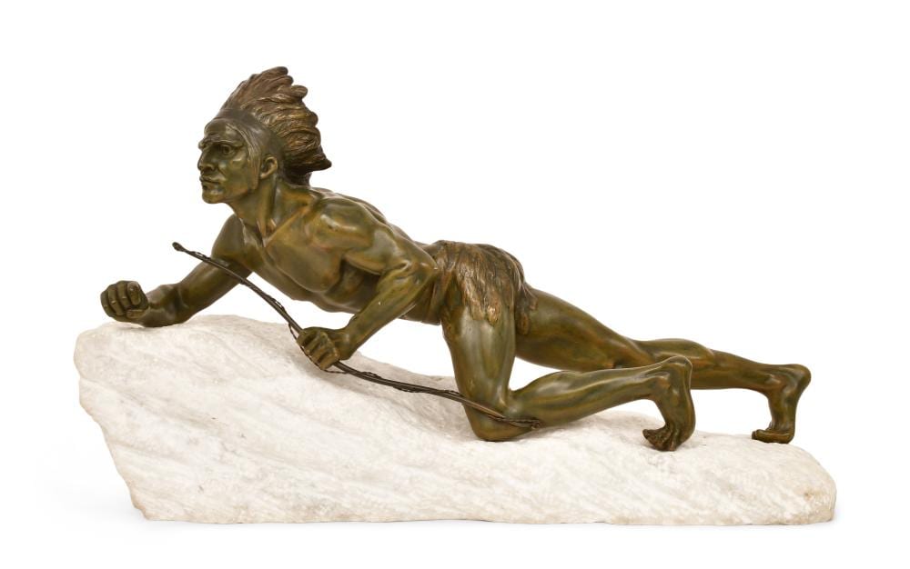 Bronze-colored sculpture of a shirtless figure crouching and aiming a bow across a light stone base, viewed in profile.