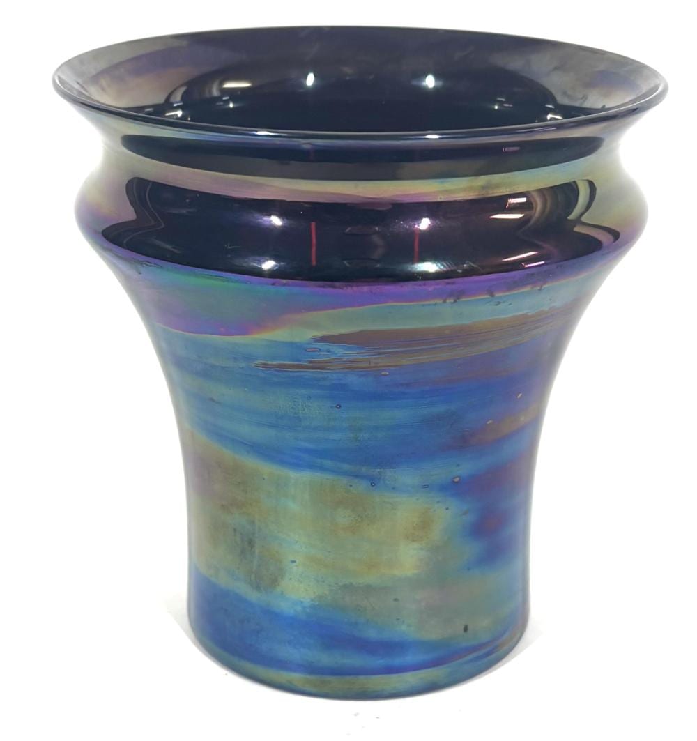 Iridescent art glass vase with a flared rim, blue and green tones with purple highlights and dark interior.