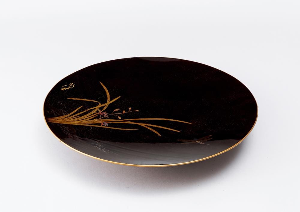 Naonobu comparable auction result: a maki e lacquer large plate with orchid design by naonobu