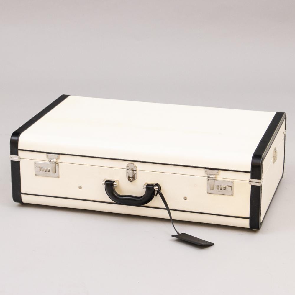 White and black hardshell suitcase with black trim and handle, shown on a light background.
