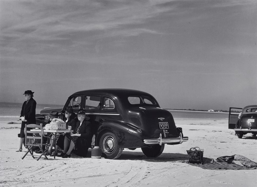 Marion Post Wolcott comparable auction result: marion post wolcott winter visitors picnic on running board of car sarasota florida 1941