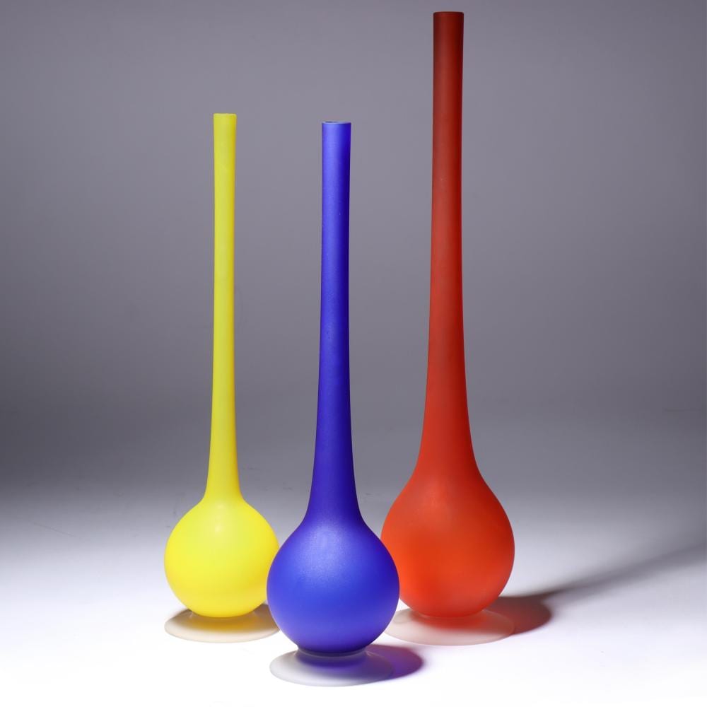 Carlo Moretti comparable auction result: group of three carlo moretti for rosenthal netter satinato murano art glass long neck vases in primary colors with clear foot 17 h x 3 3 4 diam largest