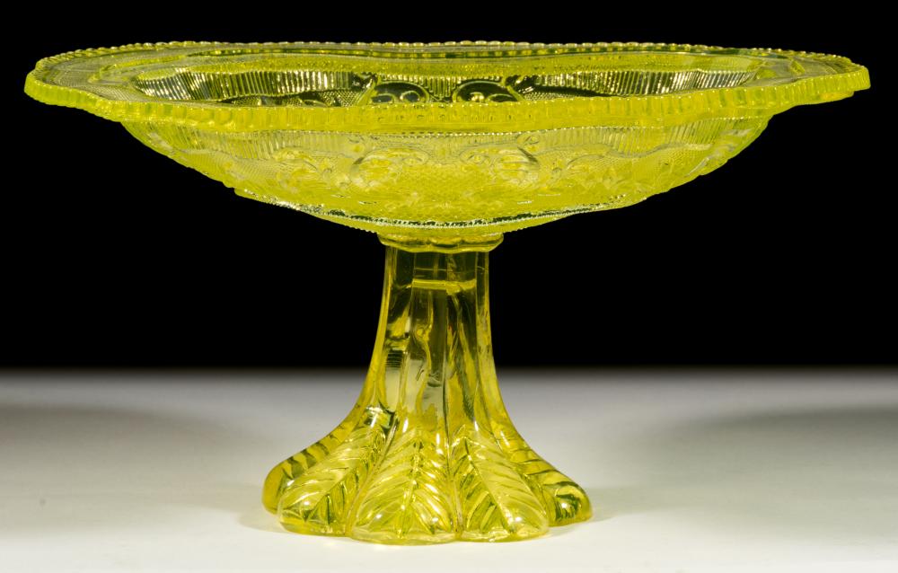 PRESSED LACY PRINCESS FEATHER MEDALLION AND BASKET OF FLOWERS COMPOTE / DISH ON FOOT sold by Jeffrey S. Evans & Associates, lot 359 — auction record photograph