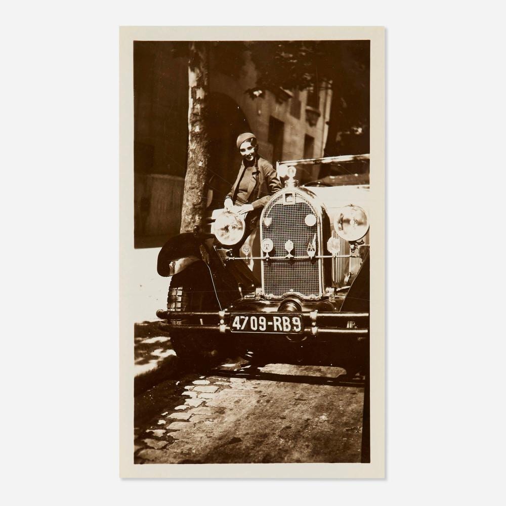 Jacques Henri Lartigue comparable auction result: jacques henri lartigue renee perle leaning on automobile paris