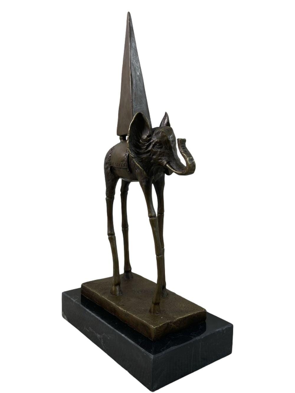 Dark bronze-colored elephant sculpture with extremely long legs and a tall tapered structure on its back, mounted on a black stone base.