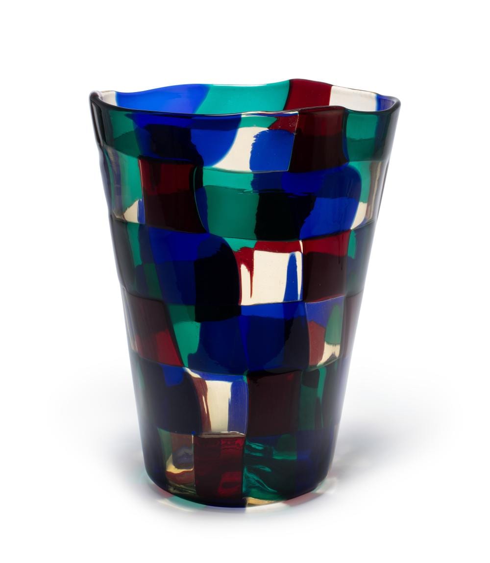 Colorful glass vase with a faceted mosaic pattern in blue, green, red, and white.