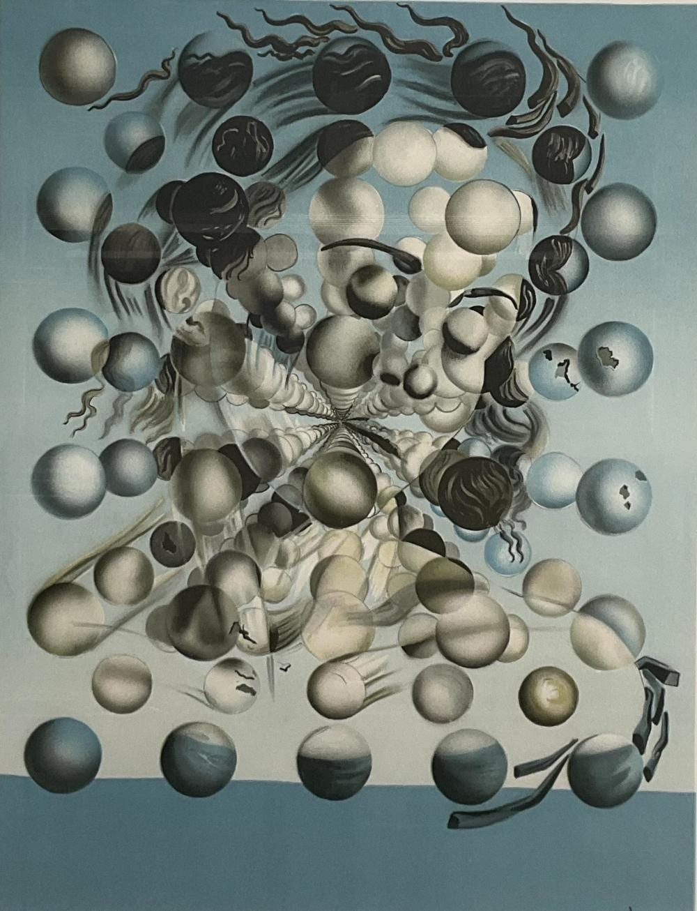 Surreal black-and-white lithograph print showing a dense field of floating spheres over a skull-like form, with a light blue background.