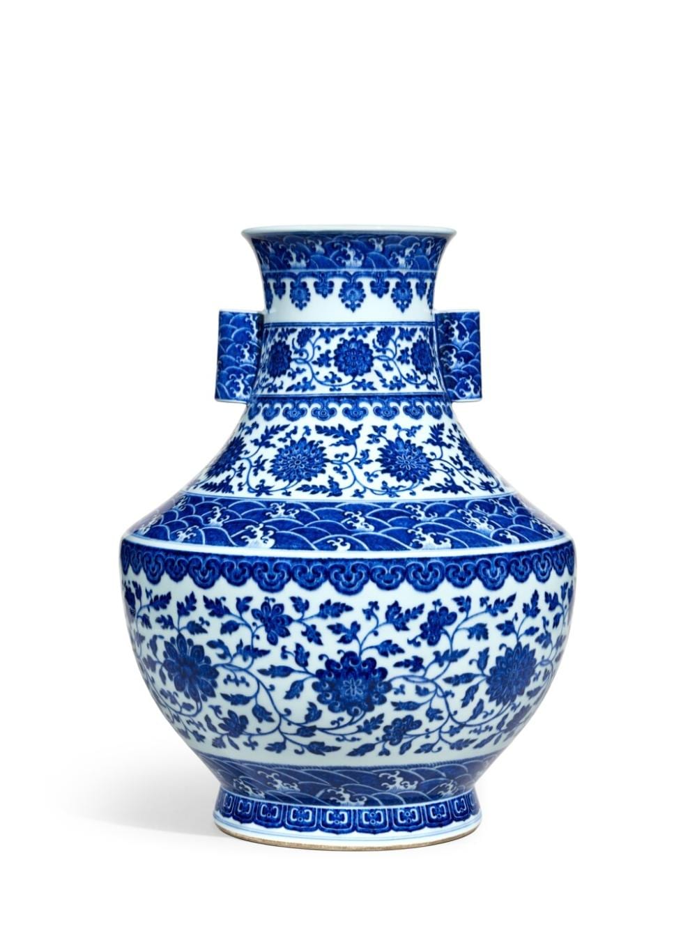 A fine and large blue and white 'lotus' handled vase, hu, Seal mark and period of Qianlong | 清乾隆　青花纏枝番蓮紋貫耳壺　《大清乾隆年製》款 comparable sale