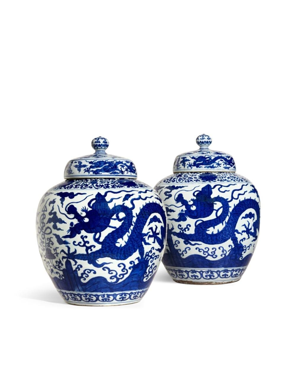 A pair of massive blue and white 'dragon' jars and covers, Marks and period of Jiajing | 明嘉靖　青花雲龍供壽紋蓋罐一對　《大明嘉靖年製》款 comparable sale