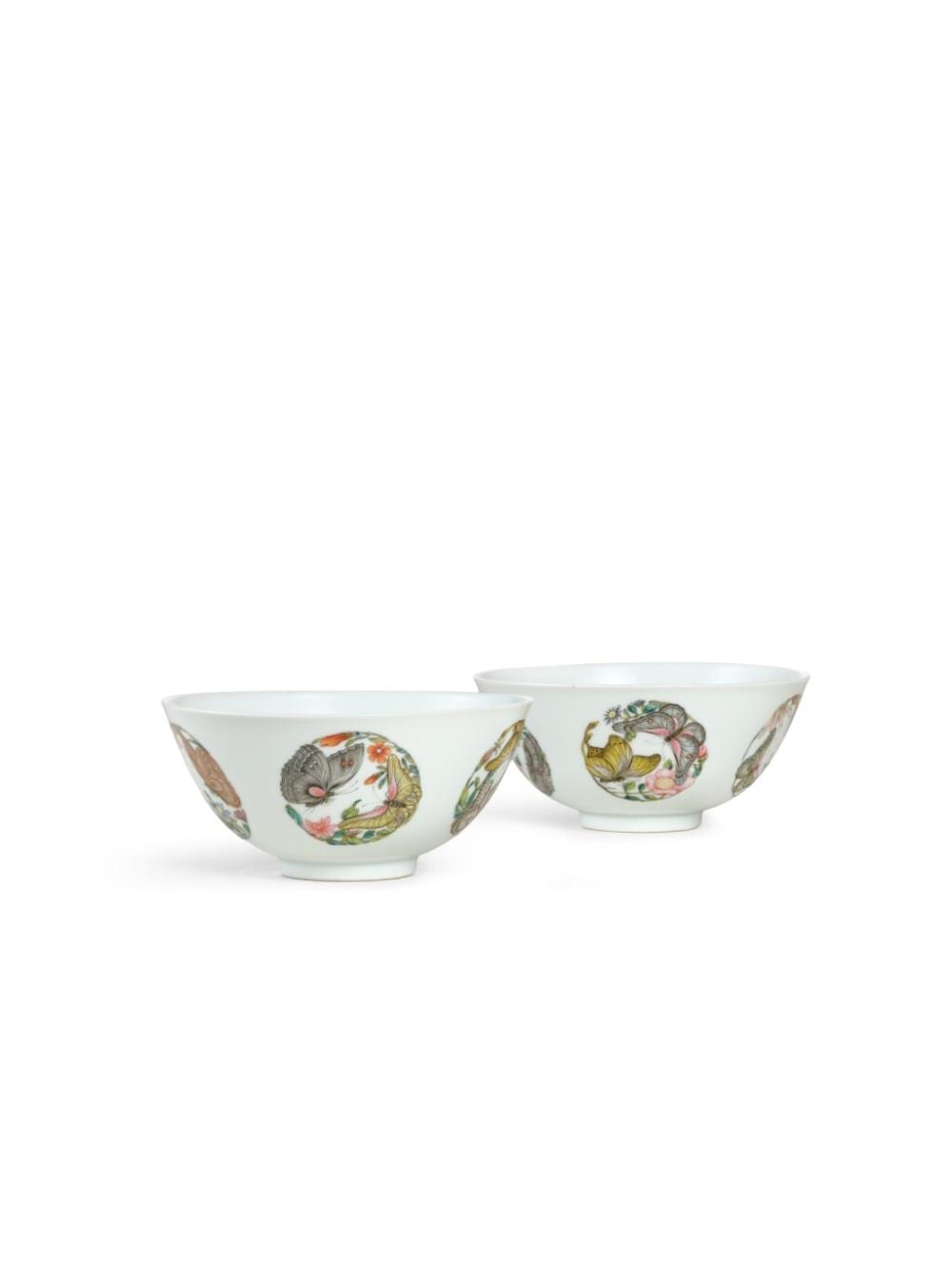 A pair of famille-rose 'butterfly' bowls, the bowls: Marks and period of Yongzheng, the enamels: possibly Yongzheng period or later | 清雍正　粉彩團蝶紋盌一對 《大清雍正年製》款 釉彩為雍正或之後 comparable sale