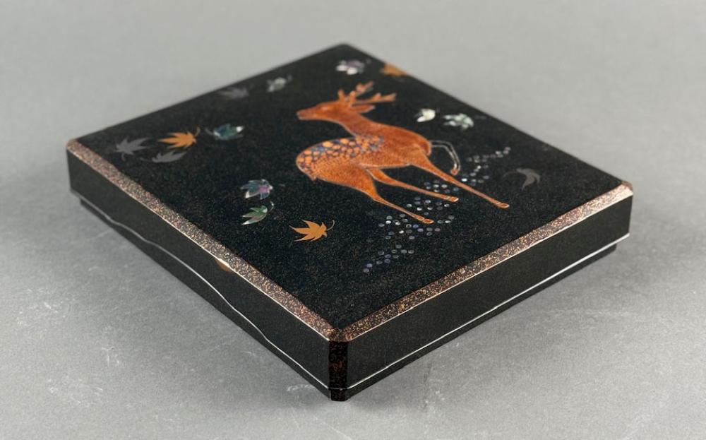 Auction comp thumbnail for JAPANESE GILT, MOTHER-OF-PEARL AND BLACK LACQUER WRITING BOX (SUZURI BAKO) Meiji Period Height 2". Width 8.5". Depth 9.5". (Eldred's, Lot 8071)