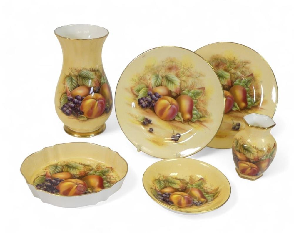 Aynsley 'Orchard Gold' design to include:- Footed ribbed vase, miniature hexagonal footed vase, oval bowl, pin tray, two side plates. Tallest:-15cm (6 pieces) sold by Potteries Auctions, lot 628 — auction record photograph
