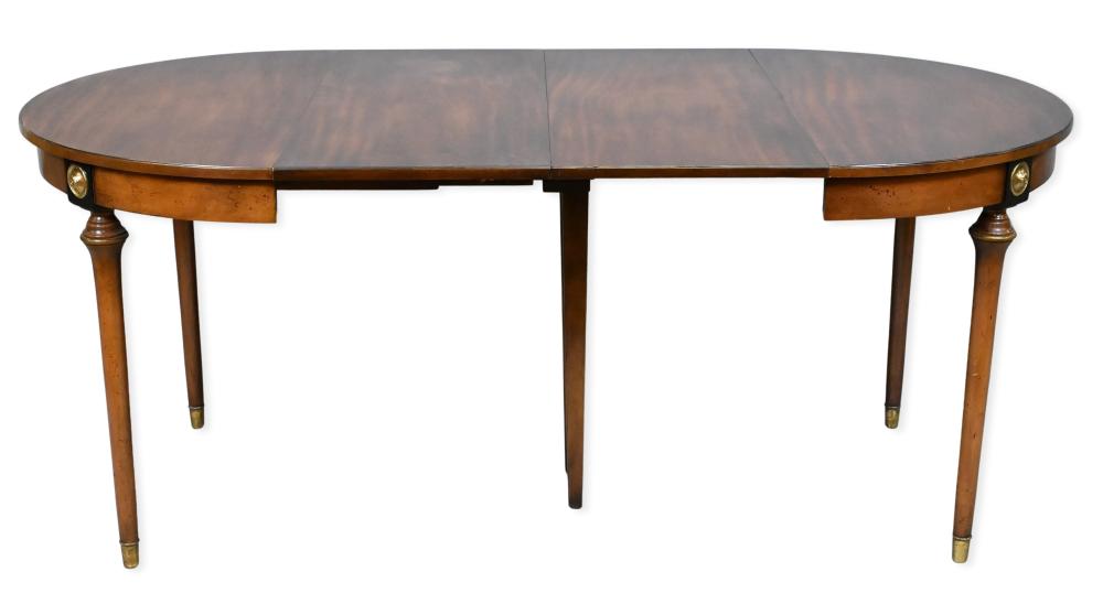 Auction comp thumbnail for Beacon Hill Furniture Old Colony Collection Extension Dining Table, mahogany extension dining table by Beacon Hill, Old Colony Collection, originally round and opening to an oval form with the addition of four 16-inch... (Nadeau's Auction Gallery, Lot 134)