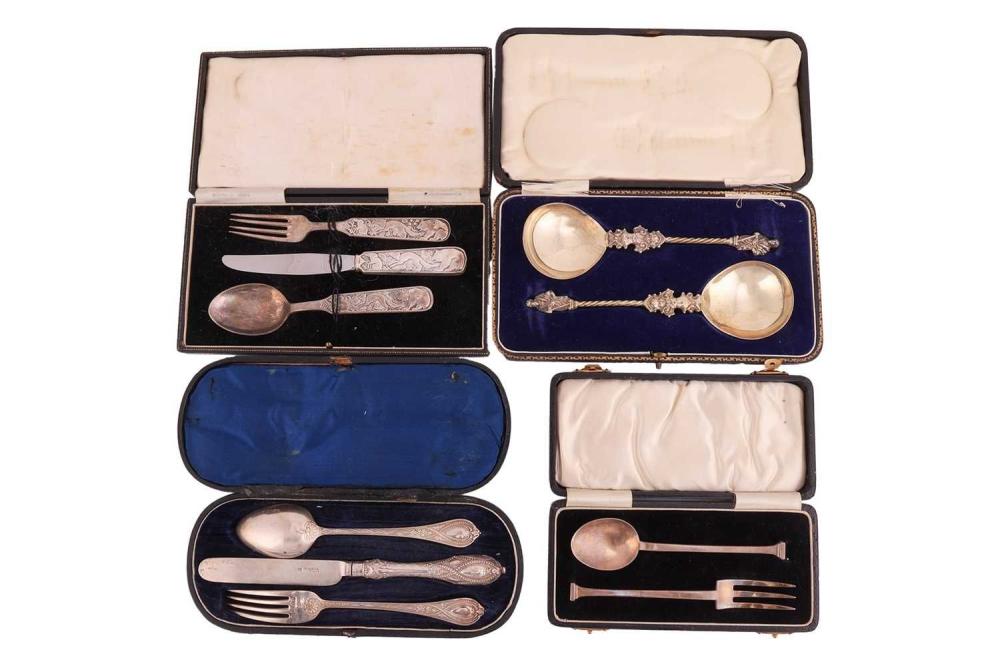 A David Anderson of Norway white metal three-piece Christening set of knife, fork and spoon cast with fox, bear and rabbit, a pair of early 20th century cast silver appostle (St.James) spoons, a cased "Doric" fork and spoon set, and a Victorian... sold by Dawsons Auctioneers, lot 399 — auction record photograph