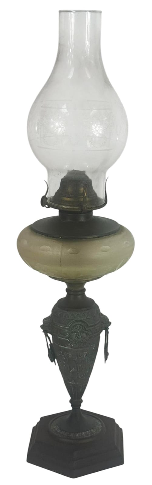 Antique style oil lamp with clear etched glass reservoir and dark metal base and burner.