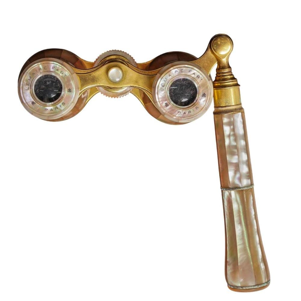 Gold opera glasses with round lenses and a mother-of-pearl style handle, shown against a white background.