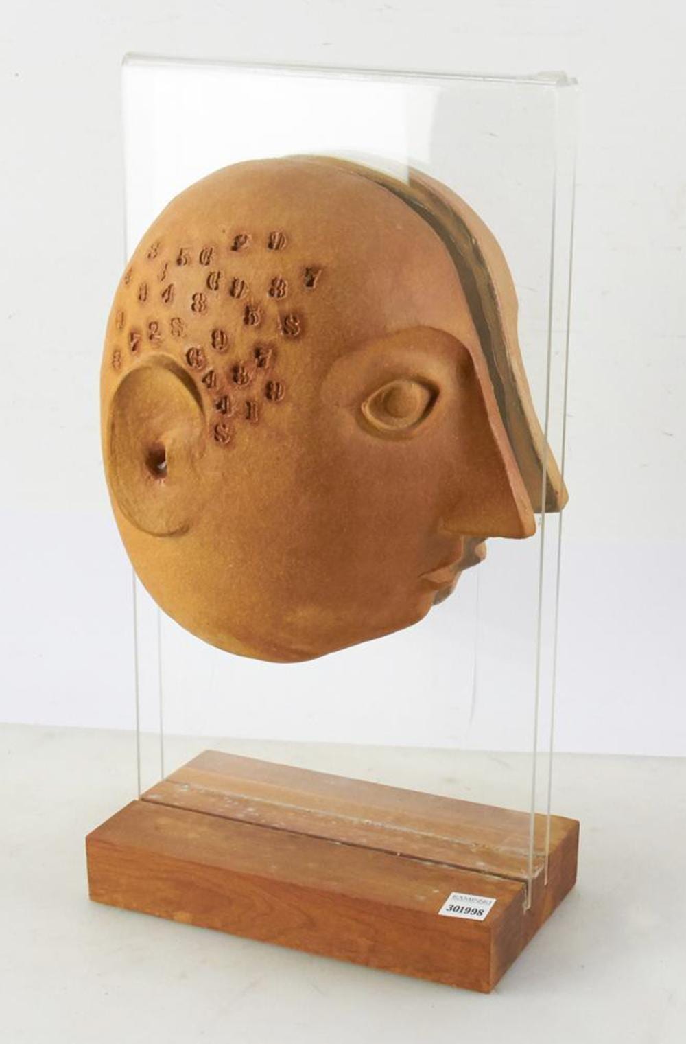 David Gil comparable auction result: david gil vermont bennington potters split head sculpture