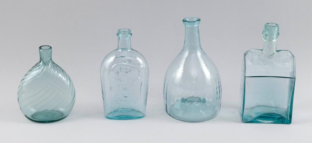 FOUR BLOWN AQUA GLASS BOTTLES Most 19th Century Heights 6.5", 7.5", 8.5" and 9". sold by Eldred's, lot 4154 — auction record photograph