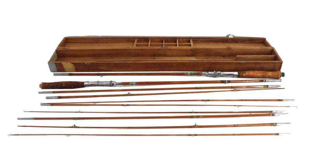 Vintage fishing fly rod set with multiple bamboo rods and a brown wooden case holding the rods.