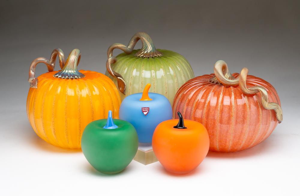 THREE SIGNED SWEDISH ORREFORS ART GLASS APPLES AND THREE SIGNED AMERICAN ART GLASS PUMPKINS. sold by Amelia Jeffers, lot 565 — auction record photograph